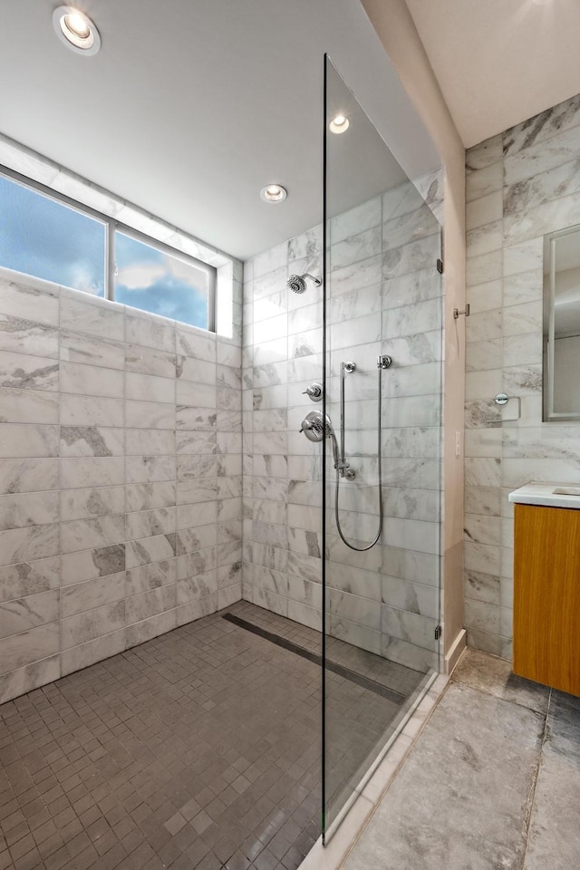 bathroom with a tile shower