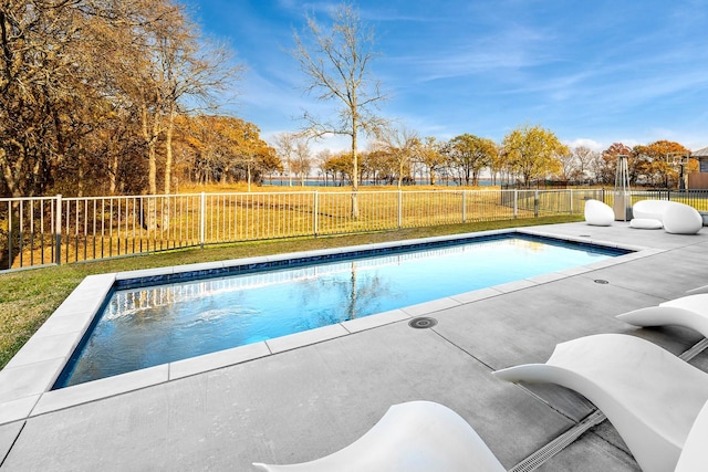 view of pool featuring a patio area and a lawn