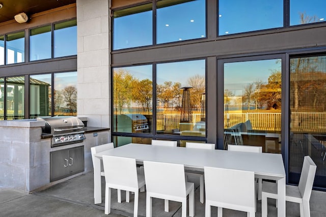 view of patio / terrace featuring area for grilling and a grill