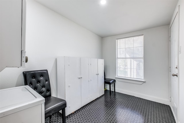 laundry room featuring dark tile patterned floors