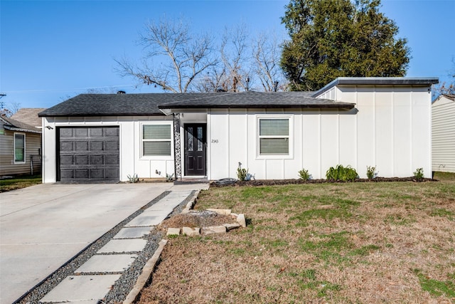 ranch-style house with a front yard and a garage