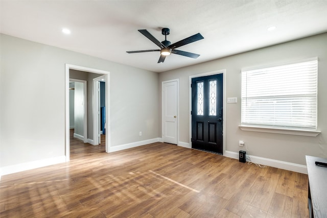 entrance foyer with ceiling fan and light wood-type flooring