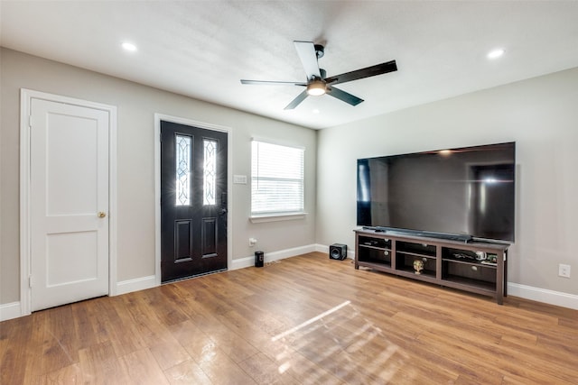 interior space with ceiling fan and light hardwood / wood-style floors