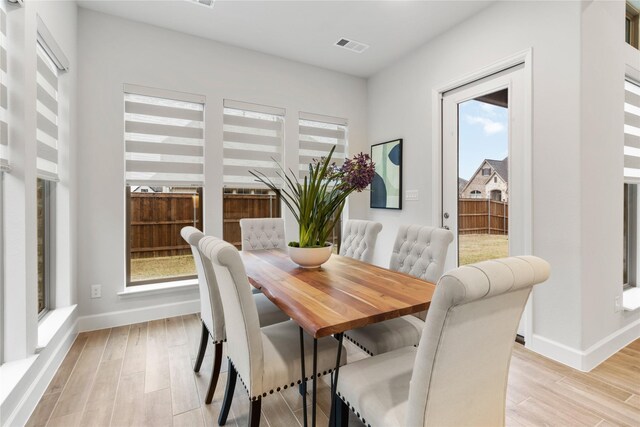 dining area with light hardwood / wood-style floors