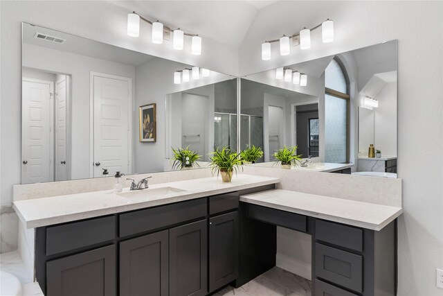 bathroom with vanity, an enclosed shower, and vaulted ceiling