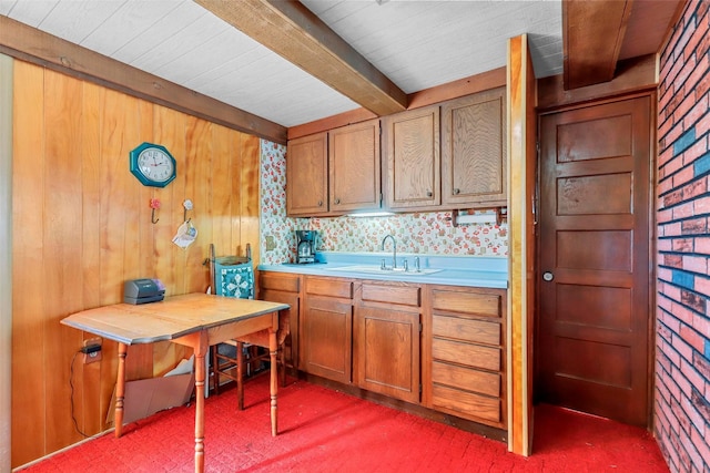 kitchen with sink and beam ceiling