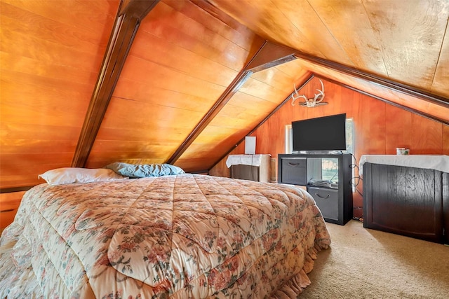 bedroom with vaulted ceiling, light colored carpet, wood ceiling, and wood walls