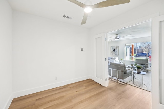 empty room featuring ceiling fan and wood-type flooring