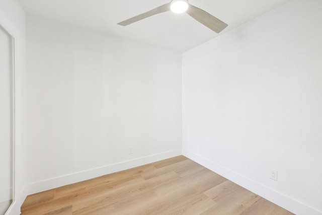 empty room with hardwood / wood-style flooring and ceiling fan