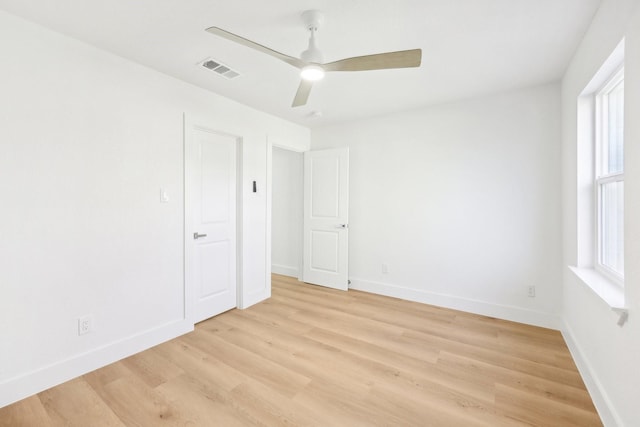 spare room with light hardwood / wood-style flooring and ceiling fan