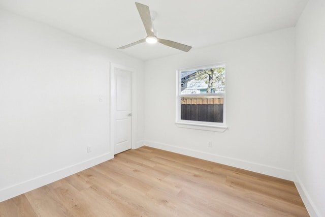 spare room featuring ceiling fan and light hardwood / wood-style flooring