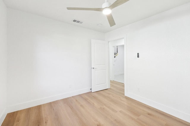 spare room with light hardwood / wood-style flooring and ceiling fan