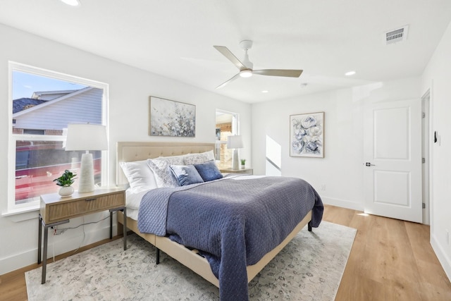 bedroom with light wood-type flooring and ceiling fan