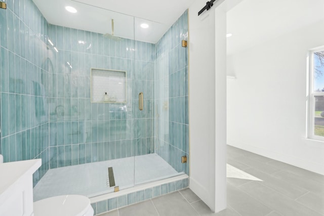 bathroom featuring tile patterned floors, vanity, an enclosed shower, and toilet