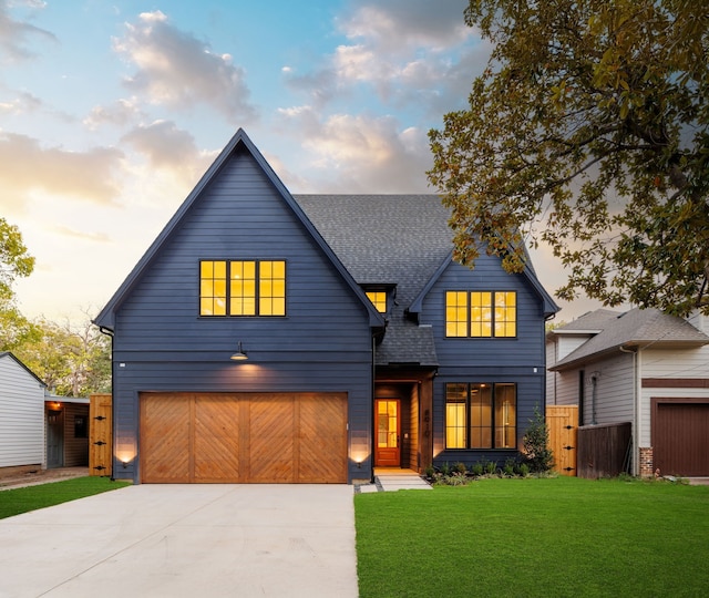 view of front facade featuring a yard and a garage