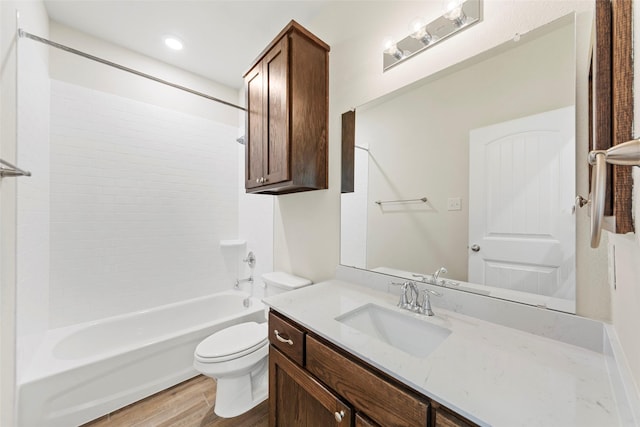 full bathroom featuring toilet, shower / washtub combination, vanity, and hardwood / wood-style flooring