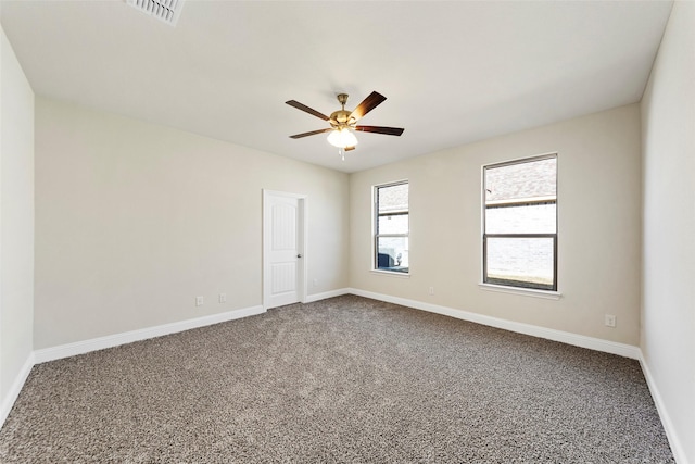 carpeted spare room with ceiling fan