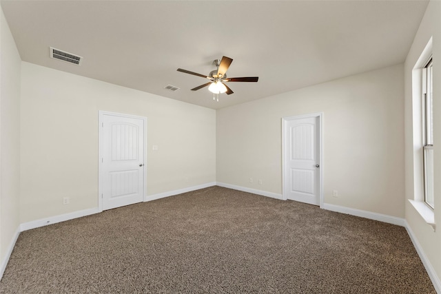 carpeted empty room with ceiling fan