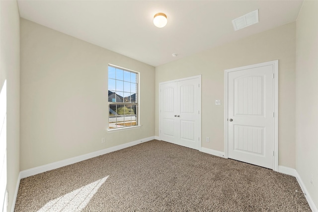 unfurnished bedroom with carpet floors