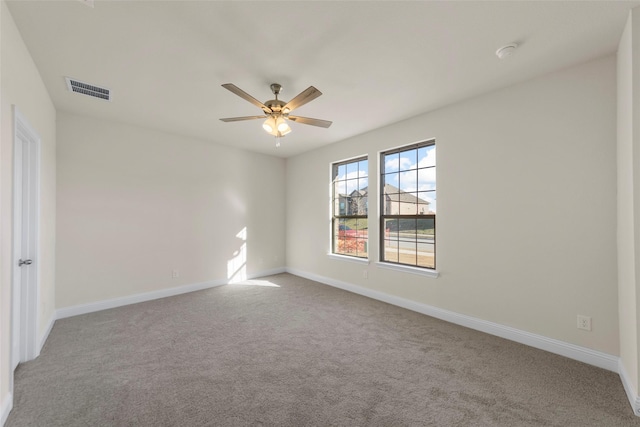 carpeted empty room with ceiling fan