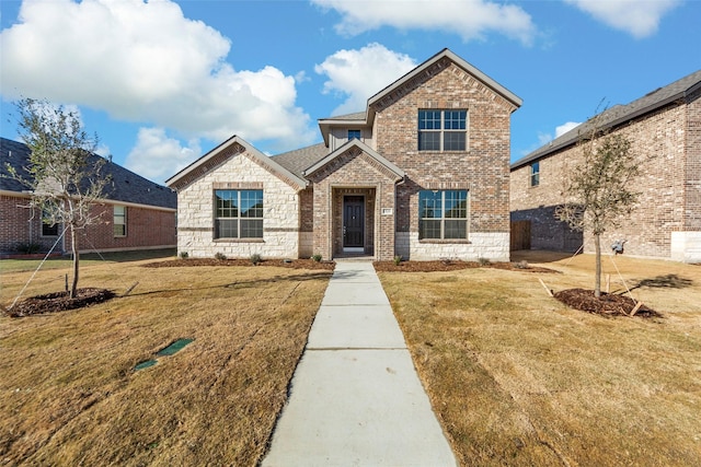 view of front of home featuring a front yard