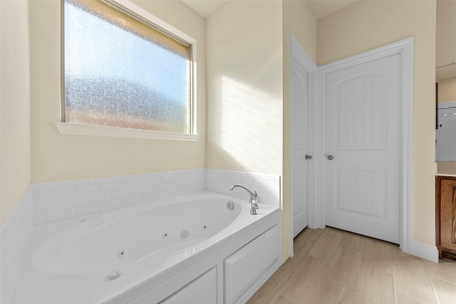 bathroom with a tub to relax in