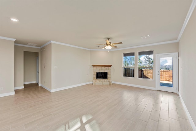 unfurnished living room with a fireplace, light hardwood / wood-style floors, ceiling fan, and crown molding