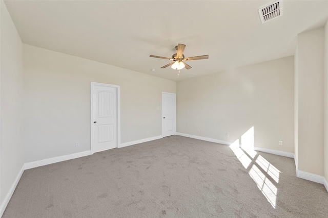 carpeted empty room with ceiling fan