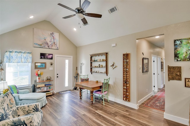 entryway with hardwood / wood-style flooring, high vaulted ceiling, and ceiling fan