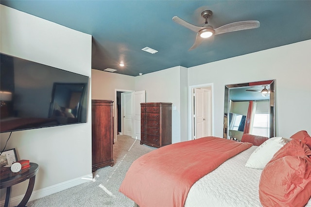 bedroom with light colored carpet and ceiling fan