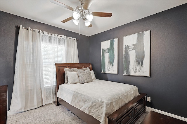 bedroom featuring multiple windows, ceiling fan, and carpet