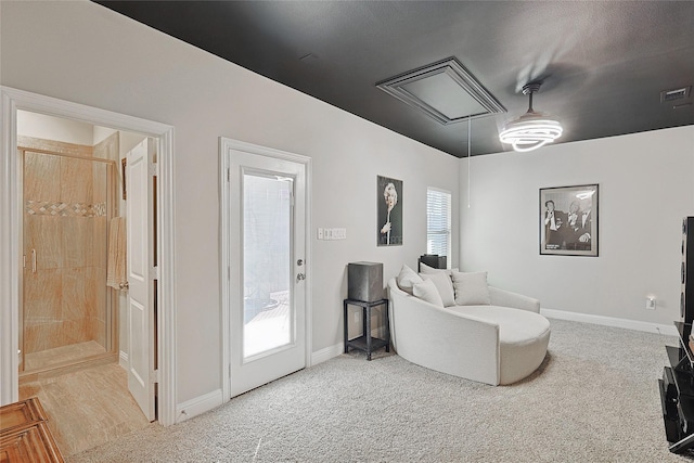 sitting room featuring plenty of natural light and carpet flooring