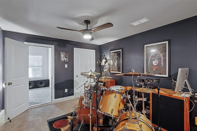 misc room featuring ceiling fan and carpet flooring