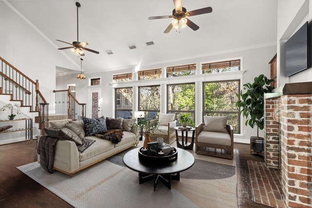 living room featuring lofted ceiling, dark wood-type flooring, ceiling fan, and crown molding