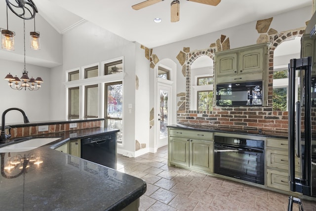 kitchen with pendant lighting, black appliances, green cabinets, sink, and vaulted ceiling