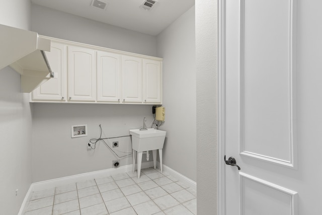 laundry area with washer hookup, light tile patterned flooring, cabinets, and hookup for an electric dryer