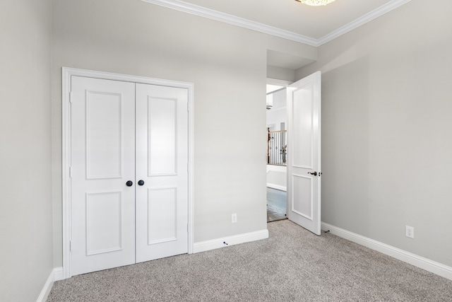 unfurnished bedroom featuring light carpet, a closet, and ornamental molding