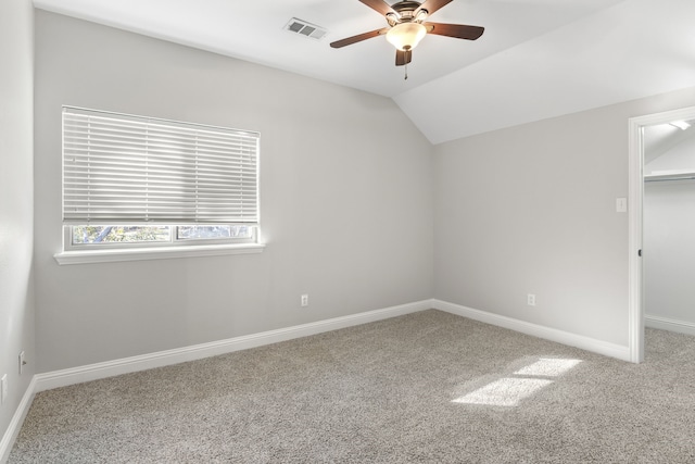 interior space featuring ceiling fan and vaulted ceiling