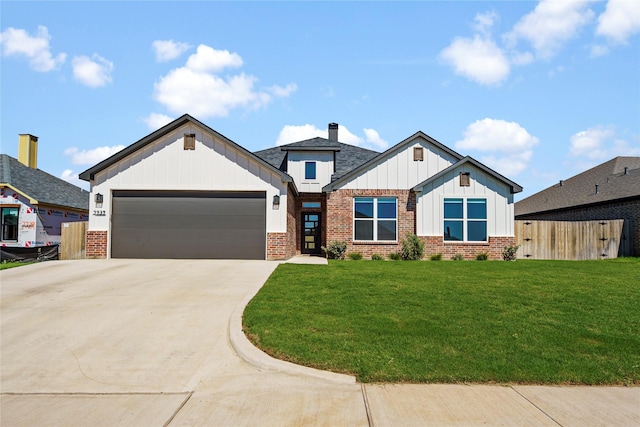 view of front of home with a garage and a front yard