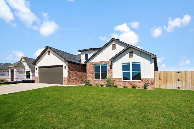 view of front facade with a garage and a front lawn