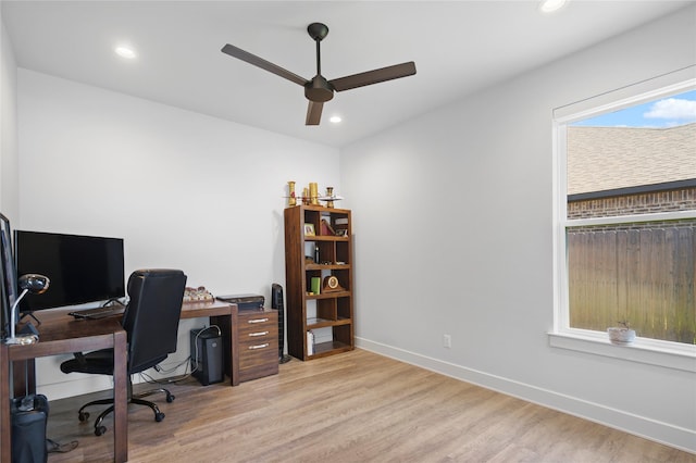 home office featuring ceiling fan and light hardwood / wood-style floors