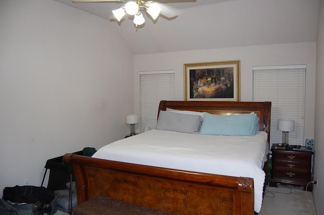 bedroom with vaulted ceiling, ceiling fan, and carpet