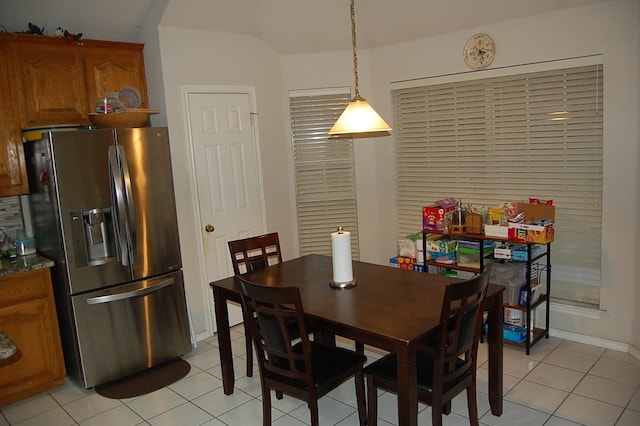 dining space featuring light tile patterned flooring