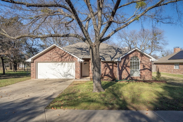 view of front of house featuring a garage and a front yard