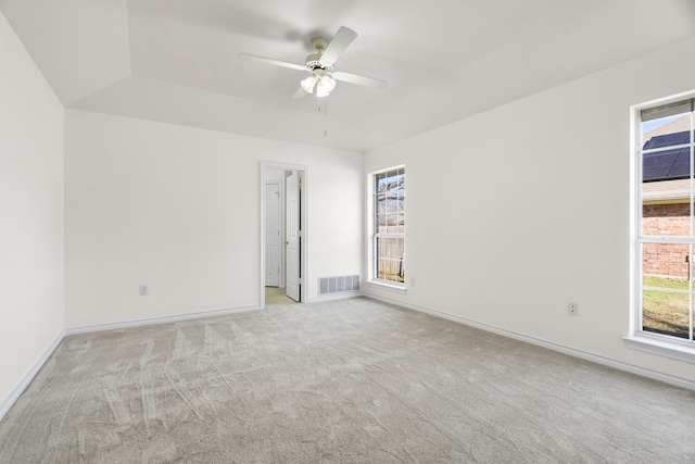 carpeted empty room featuring ceiling fan and vaulted ceiling