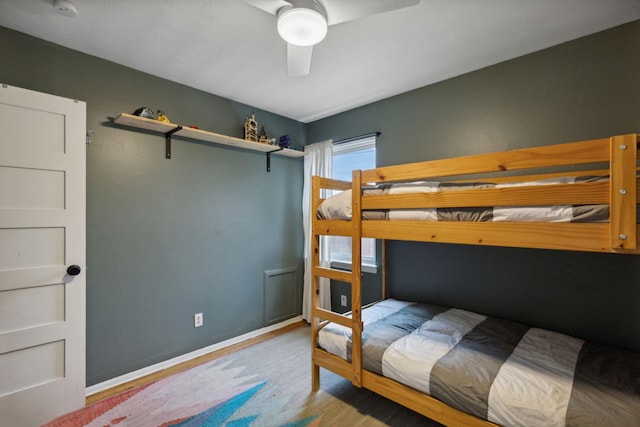 bedroom with ceiling fan and light hardwood / wood-style flooring