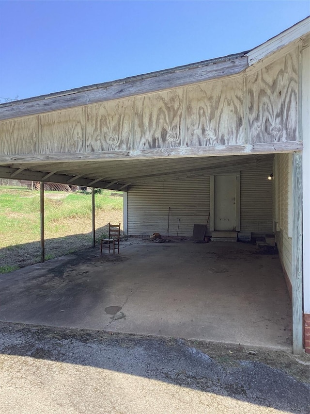 view of vehicle parking featuring a carport