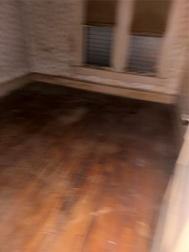 spare room with dark hardwood / wood-style flooring