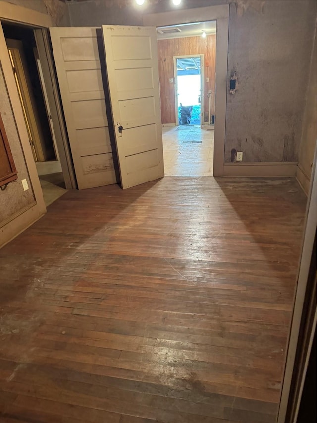 corridor featuring dark hardwood / wood-style floors