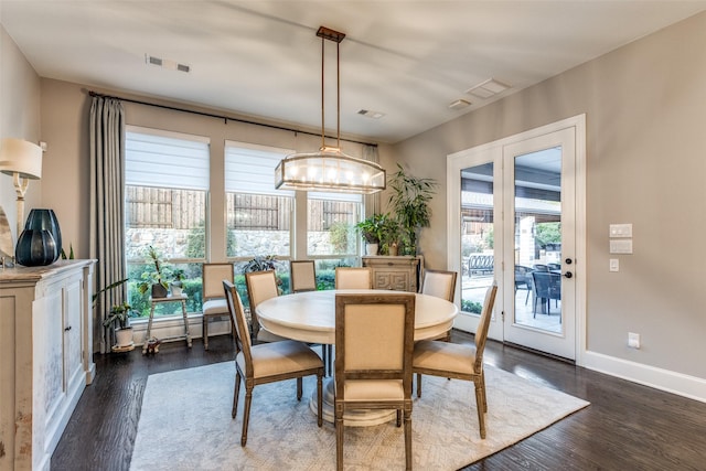 dining area with dark wood-type flooring